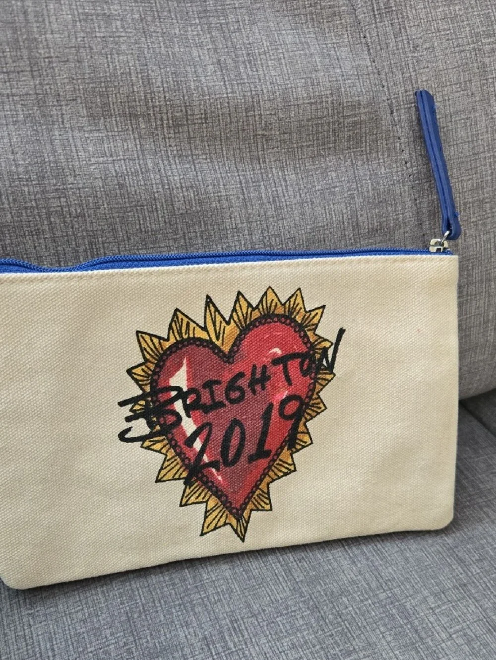 Brighton Cream Canvas Cosmetic Pouch with Blue Trim and Multicolor Heart Artwork